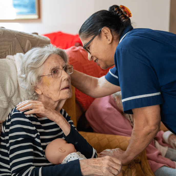Carer talking to resident at Fairways Care Home, New Romney during Alzheimer’s care