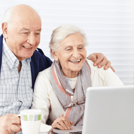 happy couple on laptop