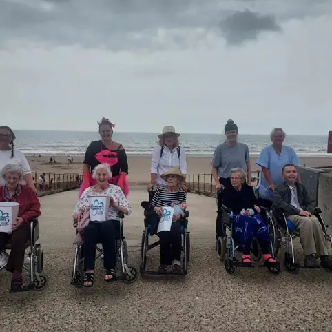 ACI Care | A group of residents having a day out at the beach