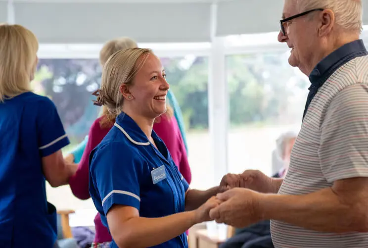 ACI Care | Fairways | A member of our staff and a resident engaged in conversation