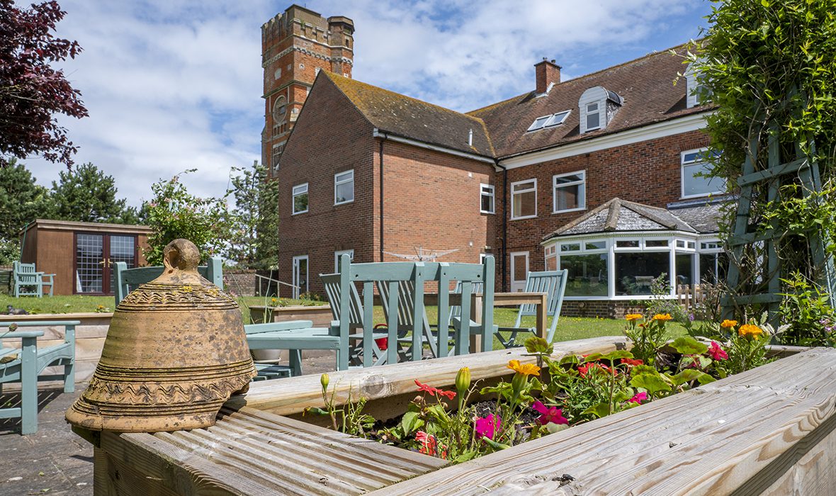 ACI Care | A warm and inviting view of Fairways Care Home in New Romney – part of Our Homes, offering quality care in a comfortable setting