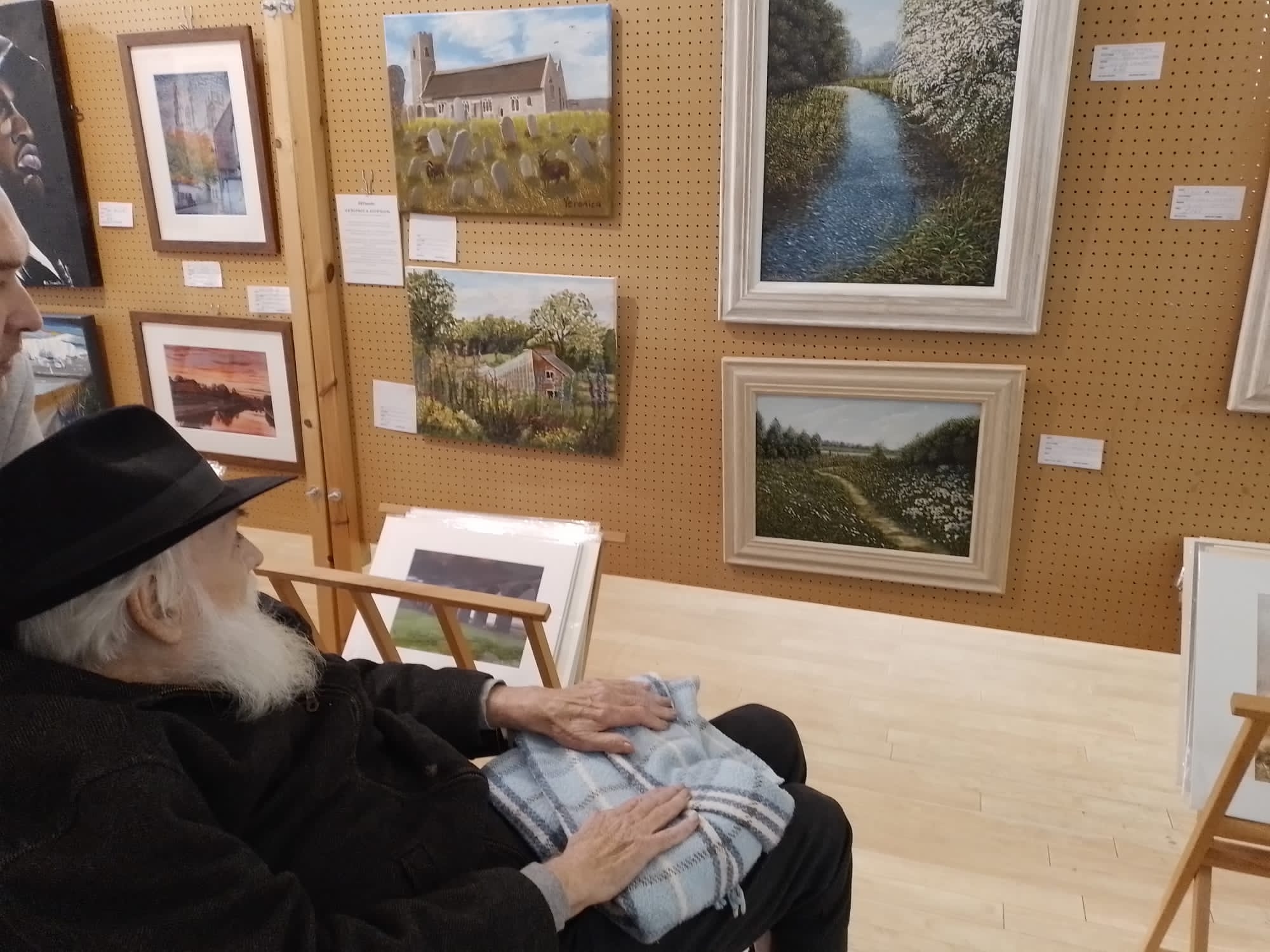 A resident looking at the art exhibition