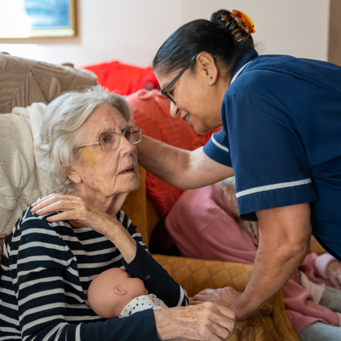 carer talking to resident for alzheimers care