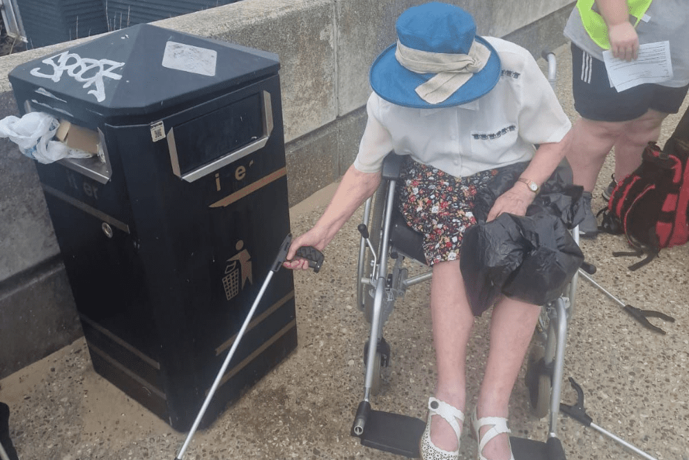 Resident helping pick up litter