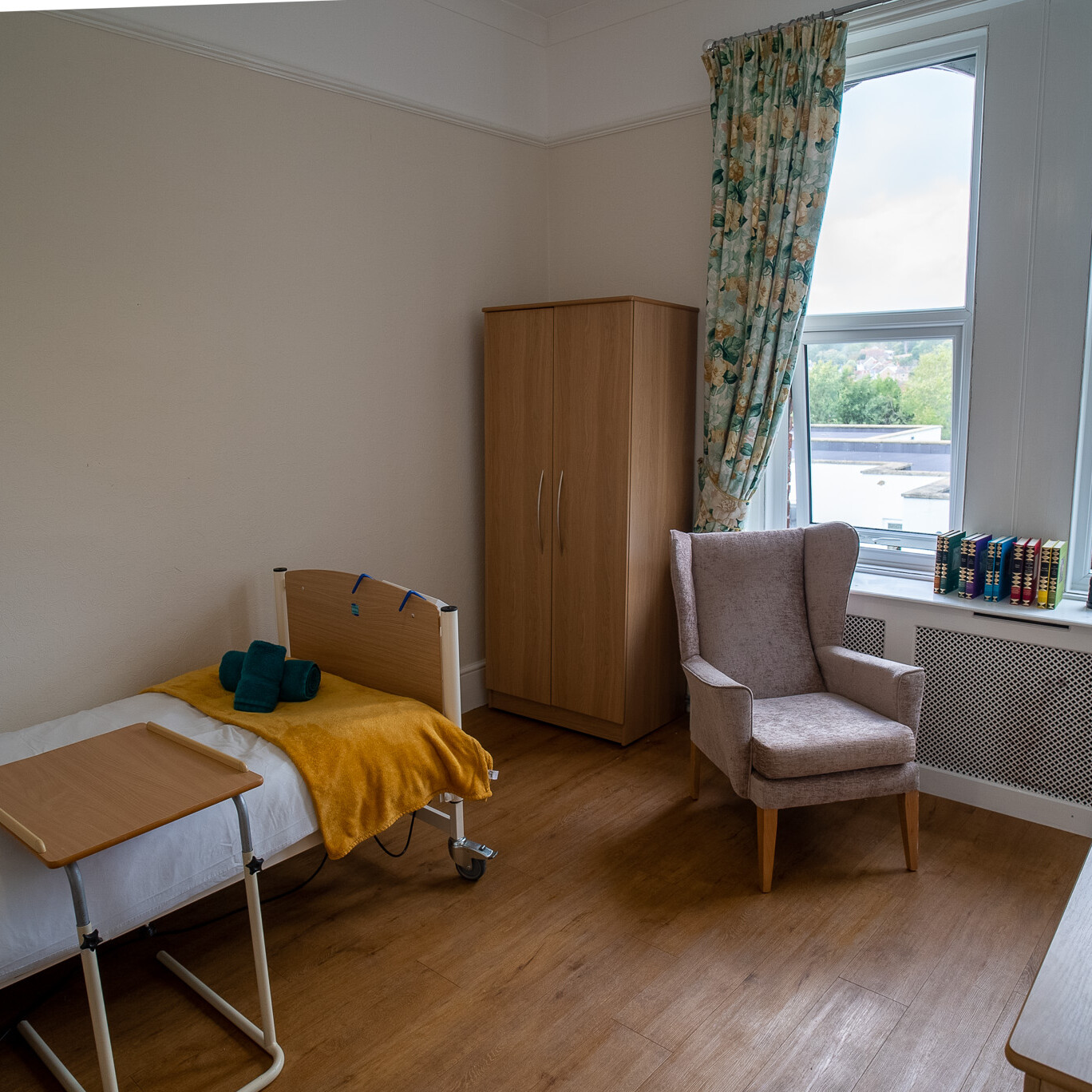 ACI Care | A single bed in a resident's room at Mountside Care Home Hastings, designed for comfort and relaxation