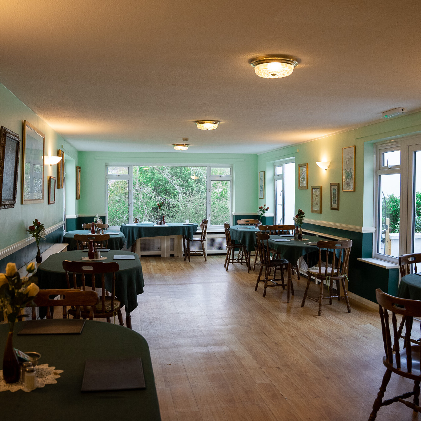 ACI Care | A spacious view of the dining room and furnishings at Mountside Care Home Hastings, providing a comfortable and inviting space for residents