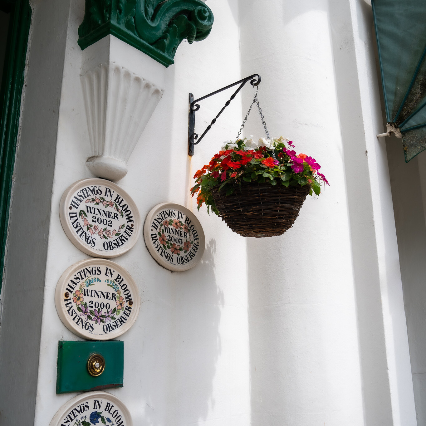 ACI Care | Hanging baskets of flowers at Mountside Care Home Hastings, adding color and charm to our outdoor spaces.