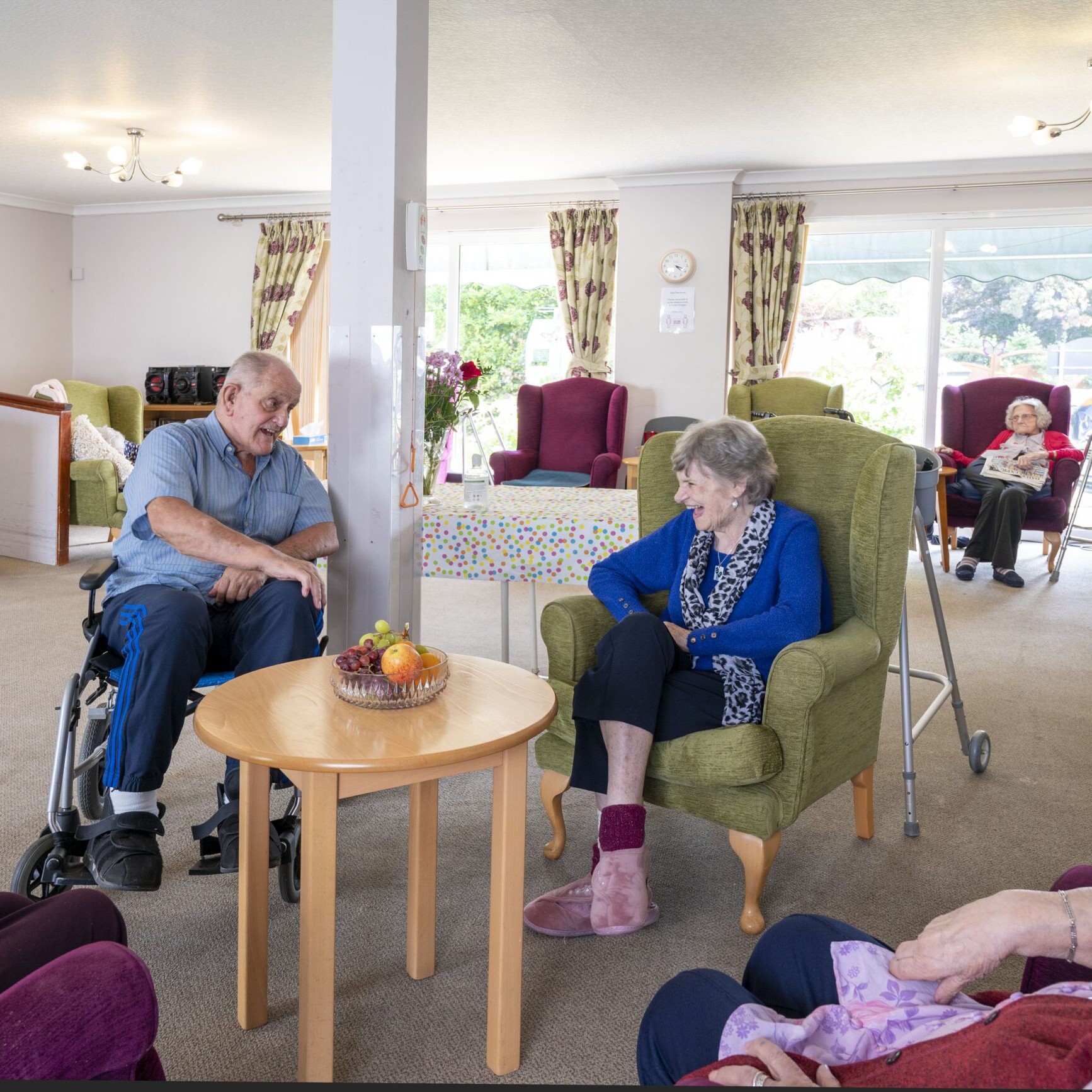 ACI Care | Residents at Mountside Care Home Hastings engaging in a group activity, fostering social interaction and enjoyment.