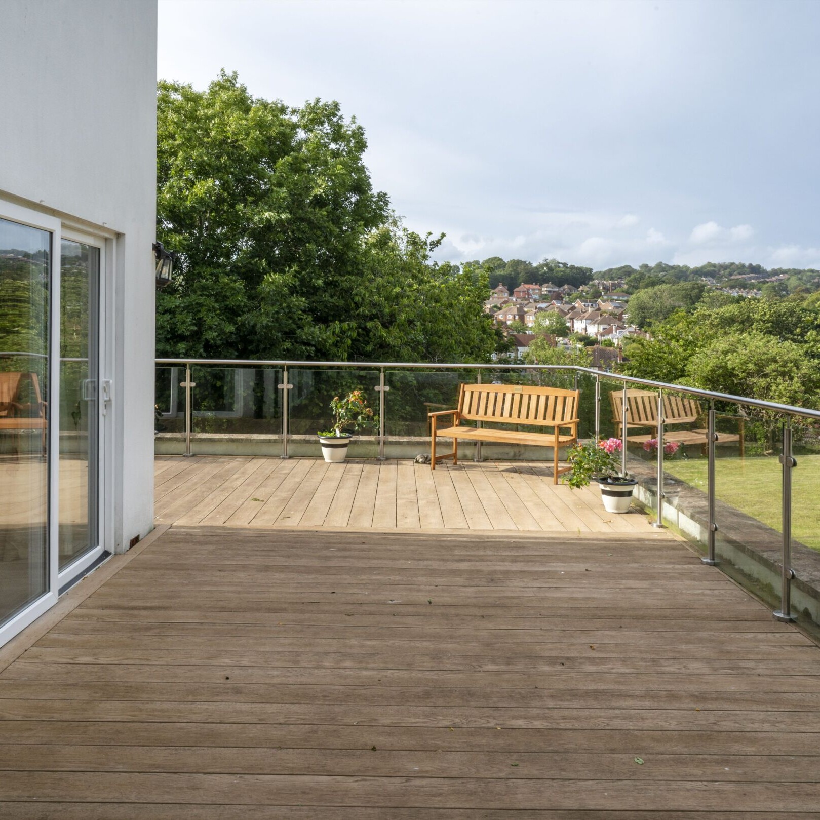 ACI Care | A view of the outdoor decking at Mountside Care Home Hastings, offering a comfortable space for residents to unwind