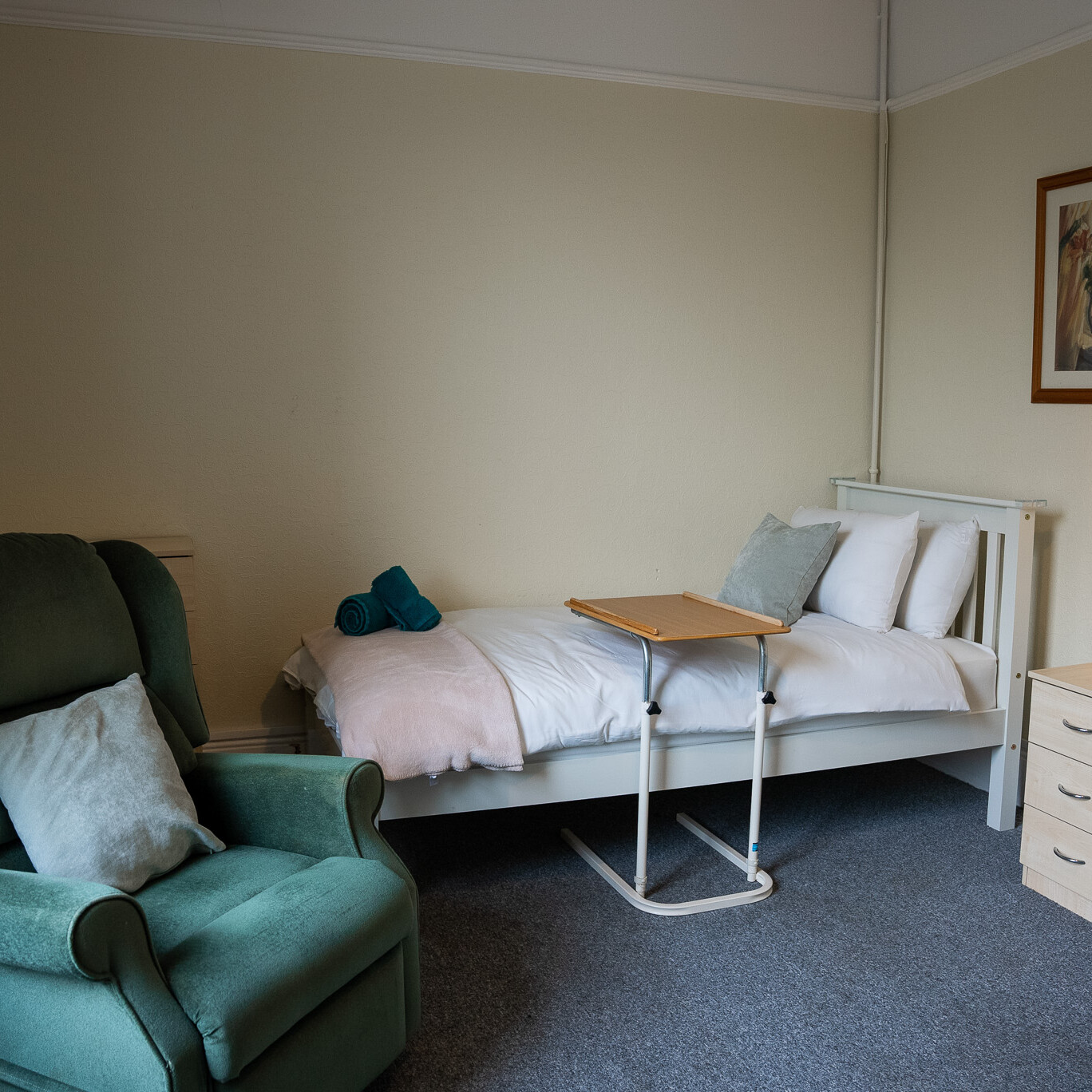 ACI Care | A cozy and well-furnished resident room at Mountside Care Home Hastings, offering comfort and privacy