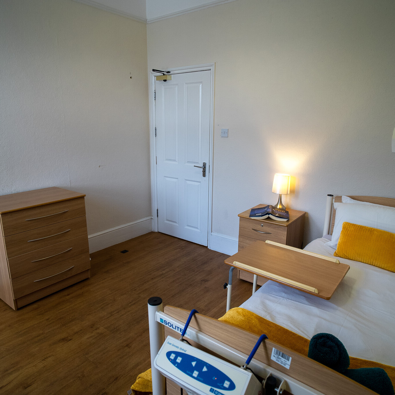 ACI Care | A comfortable and well-furnished resident room at Mountside Care Home Hastings, providing a welcoming living space.